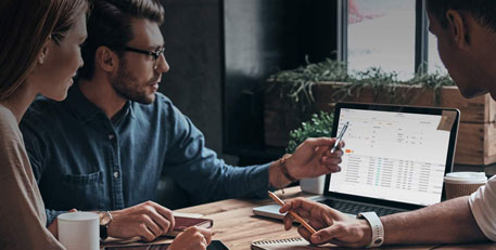 three people looking at epay conductor software on a computer screen