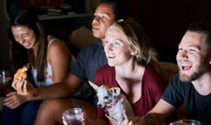 A group of people watching a screen